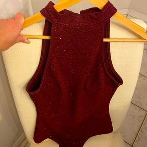 Burgundy halter one piece body suit with red shimmer. Size med.
